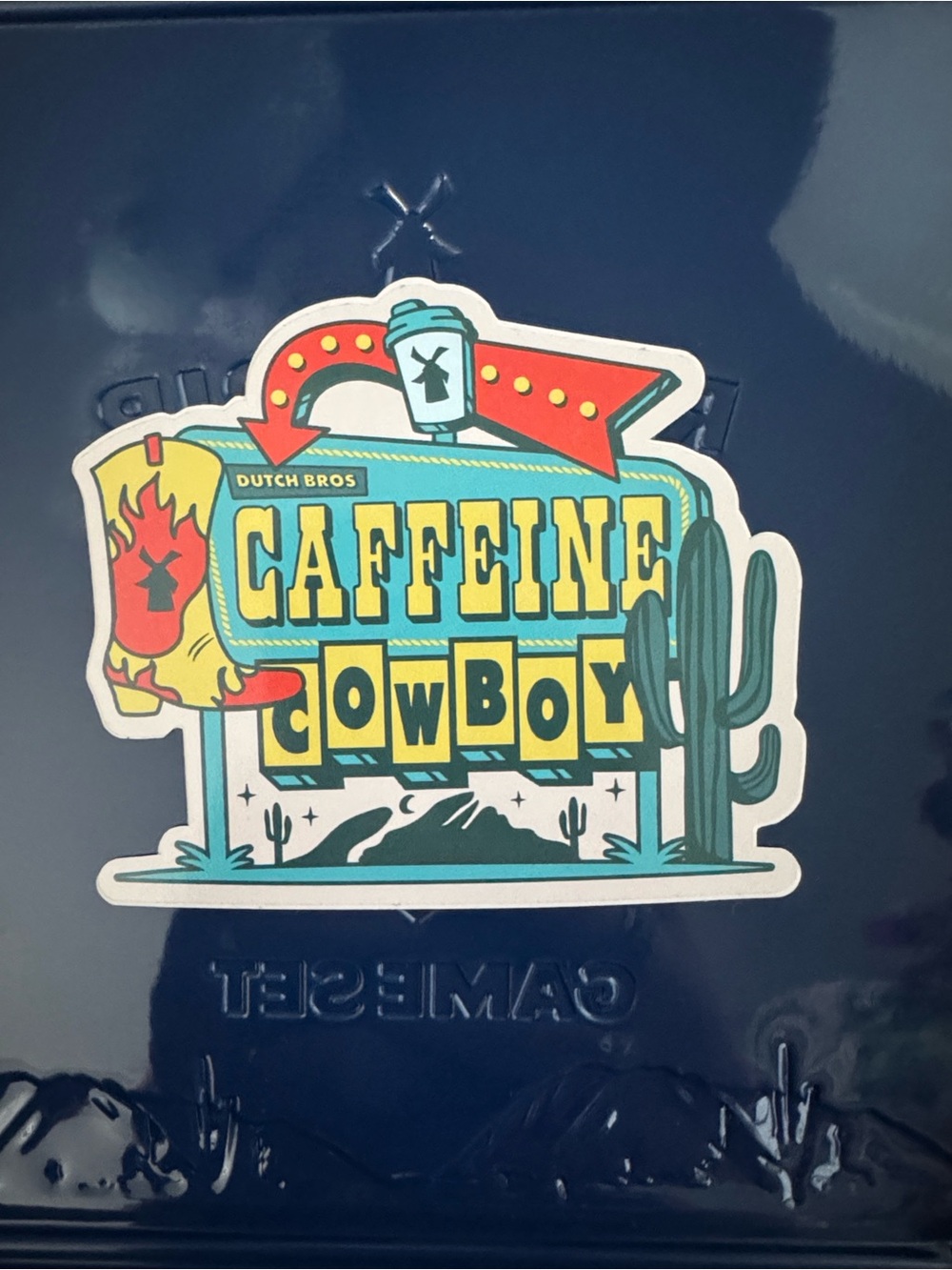 Dutch Bros Caffeine Cowboy Sticker - Teal, Yellow & Red